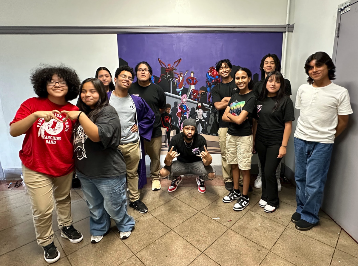 Seniors from the Digital Art Pathway show in front of the Senior Mural, 2024.